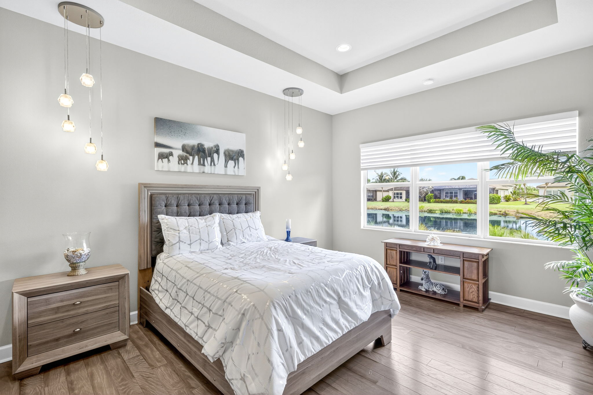 Direct lake view from primary suite with tray ceiling.