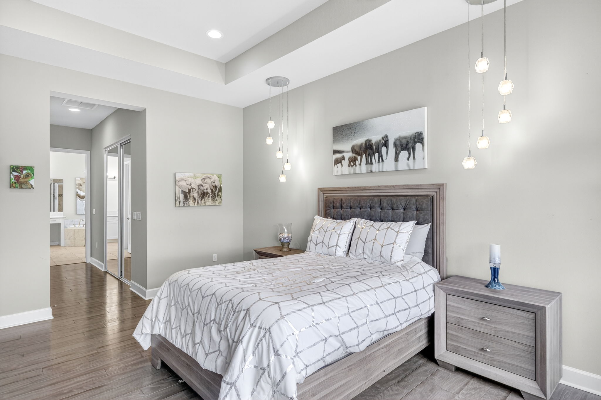 Primary bedroom with view of primary closets and bathroom.