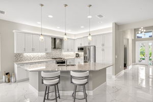 Bar seating for 4-6, pendant lighting.  All very tasteful.