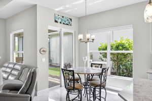 Breakfast area open to covered lanai with lake views.