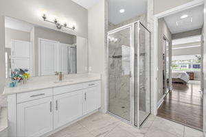 Beautiful floor to ceiling tile in shower with listello tile trim and shower niche!