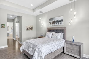 Primary bedroom with view of primary closets and bathroom.