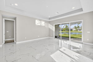 The heart of the home! This great room is spacious and features a tray ceiling and entrance to the primary suite...