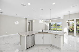 Functional work triangle, bar seating for 4-6, pendant lighting. All very tasteful.