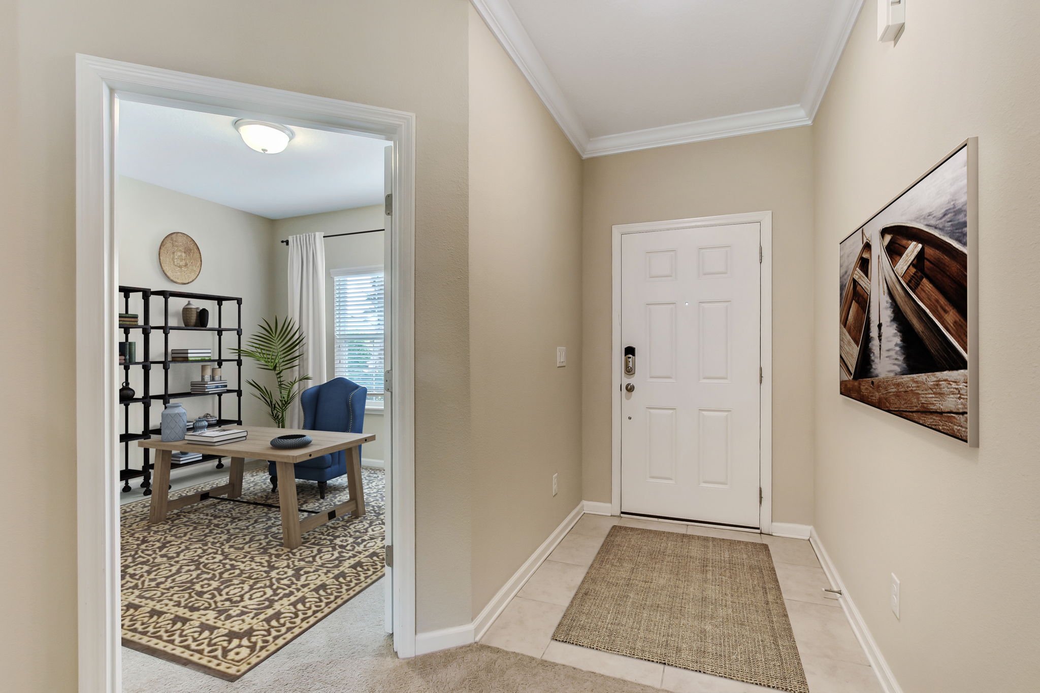 Ceramic tiled foyer with French-doored study