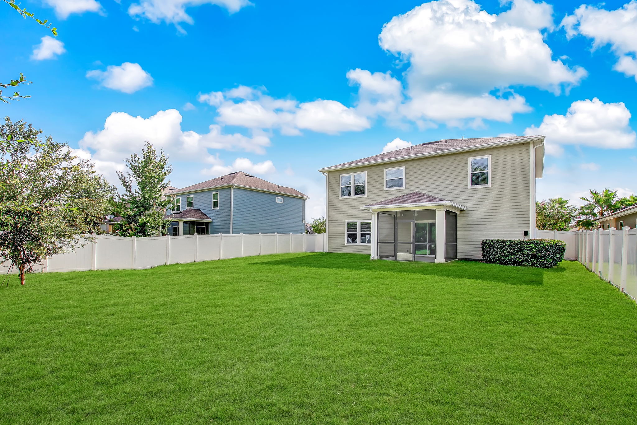 Large back yard, completely fenced overlooking treed, lake setting