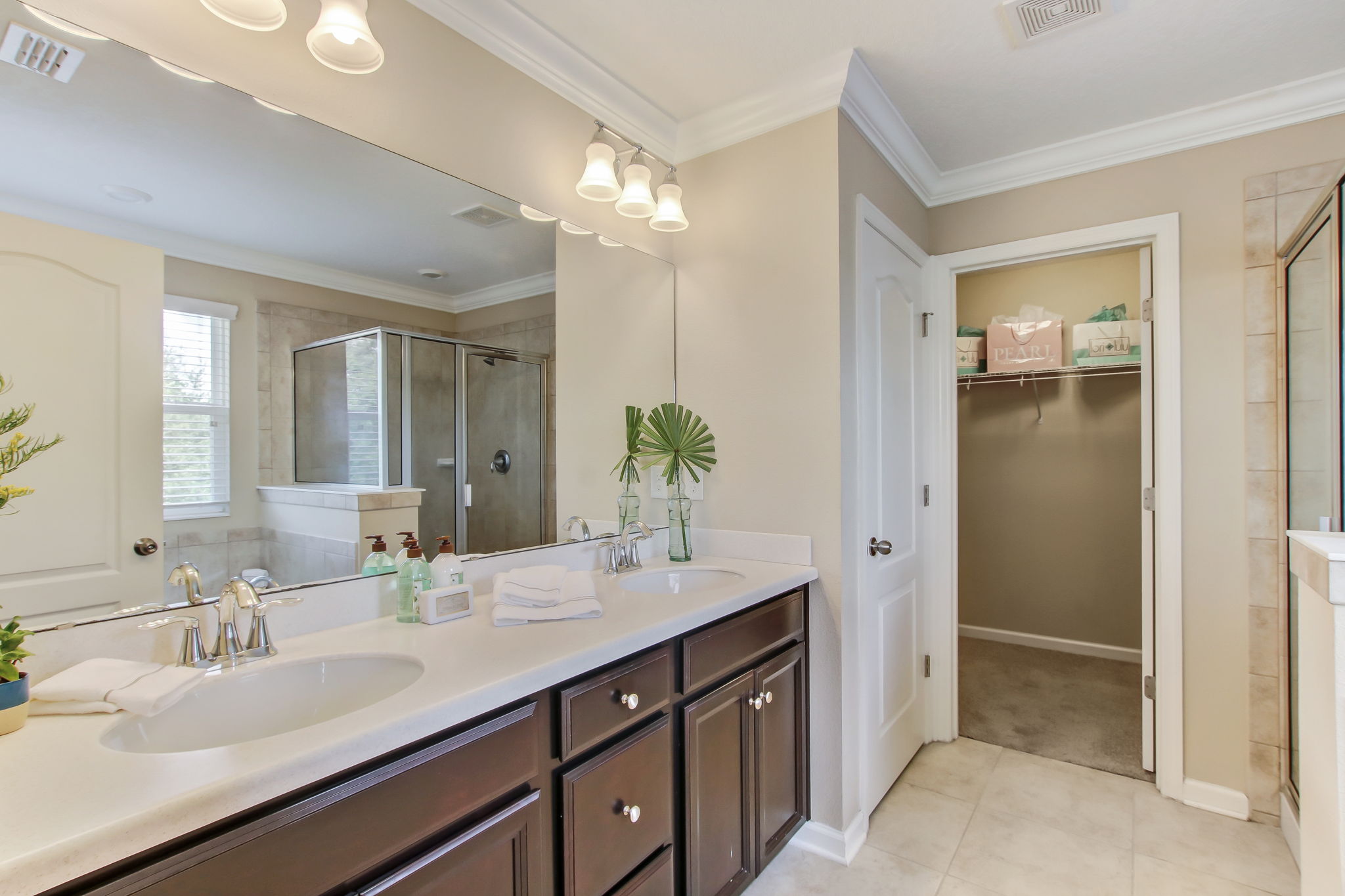 Master bath with his and her sinks and enormous walk-in closet