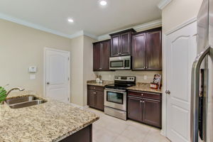 Accented by granite countertops and stainless steel appliances