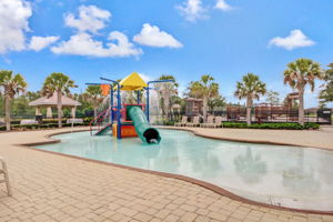 Watch your kids play in the children's splash pool.