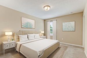 Guest bedroom one with plenty of room for beds, bureaus and desks