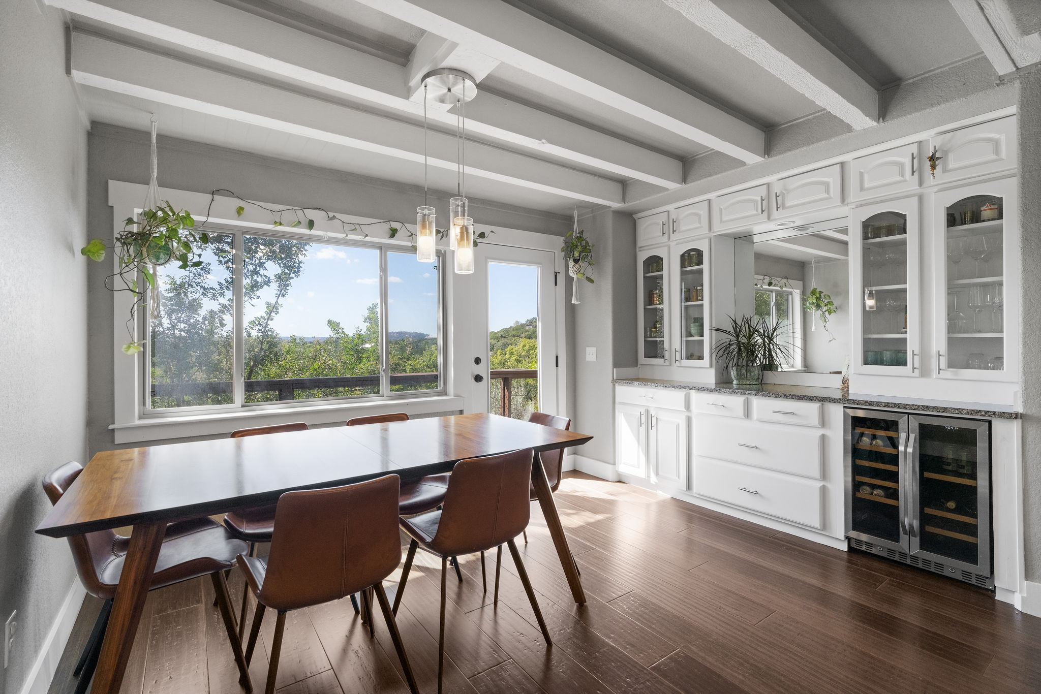 The dining room seamlessly opens to the porch, providing even more stunning views.