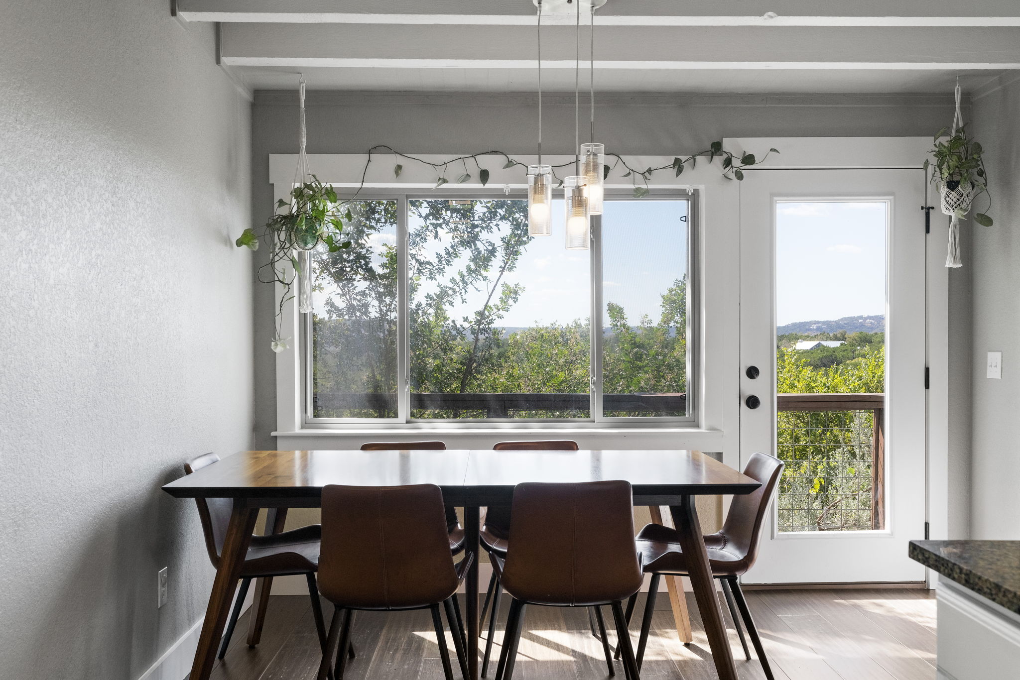 The dining room seamlessly opens to the porch, providing even more stunning views.