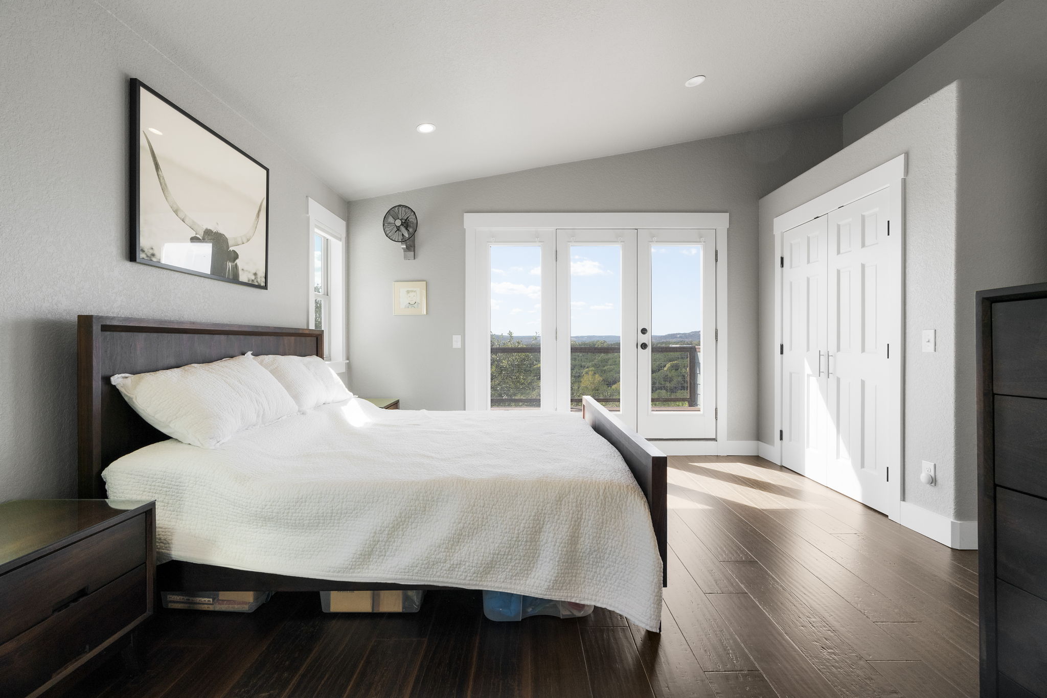 The primary bedroom upstairs features its own private deck that overlooks a secluded valley.