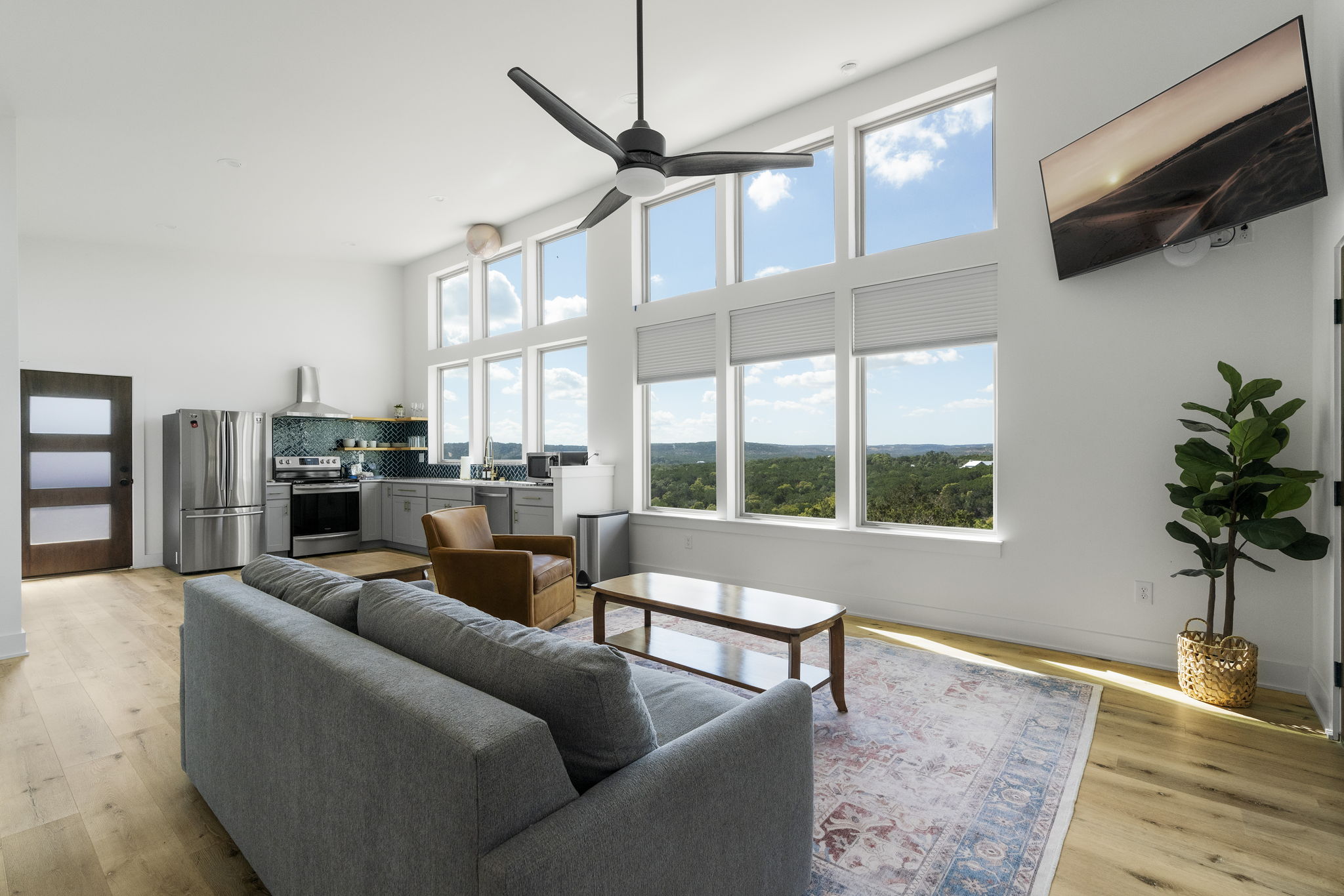 This 2-bedroom, 1-bathroom fully furnished unit boasts floor-to-ceiling windows, offering sweeping views of the Wimberley Valley from every corner of the kitchen, and living areas.