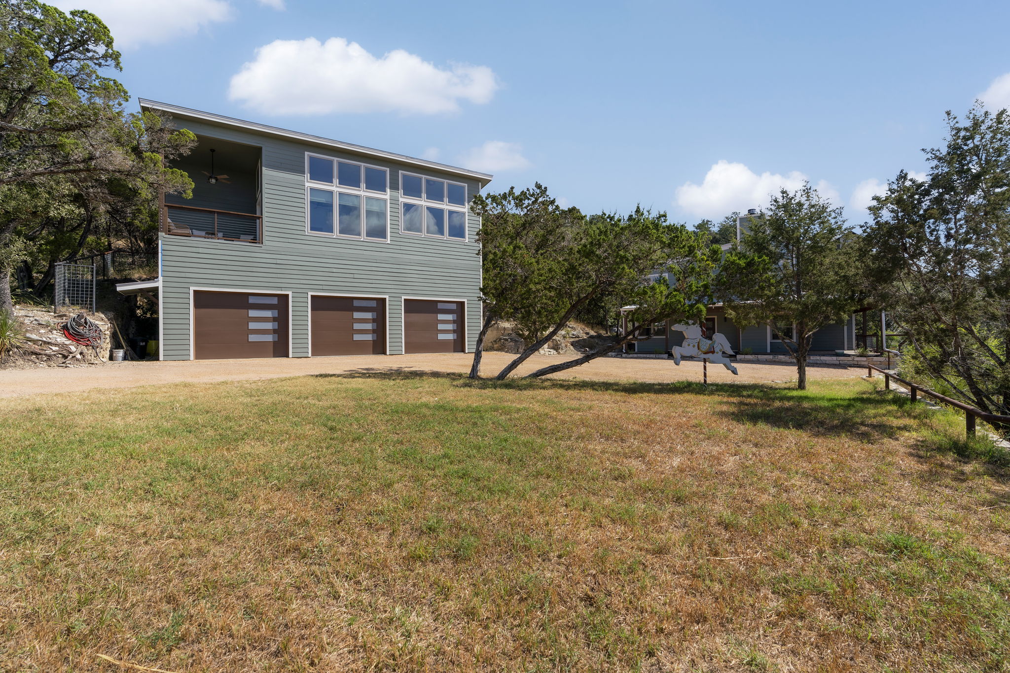 This 2-bedroom, 1-bath fully furnished unit features a second-floor entrance with floor-to-ceiling windows that showcase stunning views of the Wimberley Valley. Please note, the 3-car garage is reserved for owner storage and is not available for tenant use.