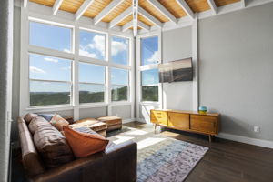 An additional living room upstairs offers sweeping views of the Hill Country.