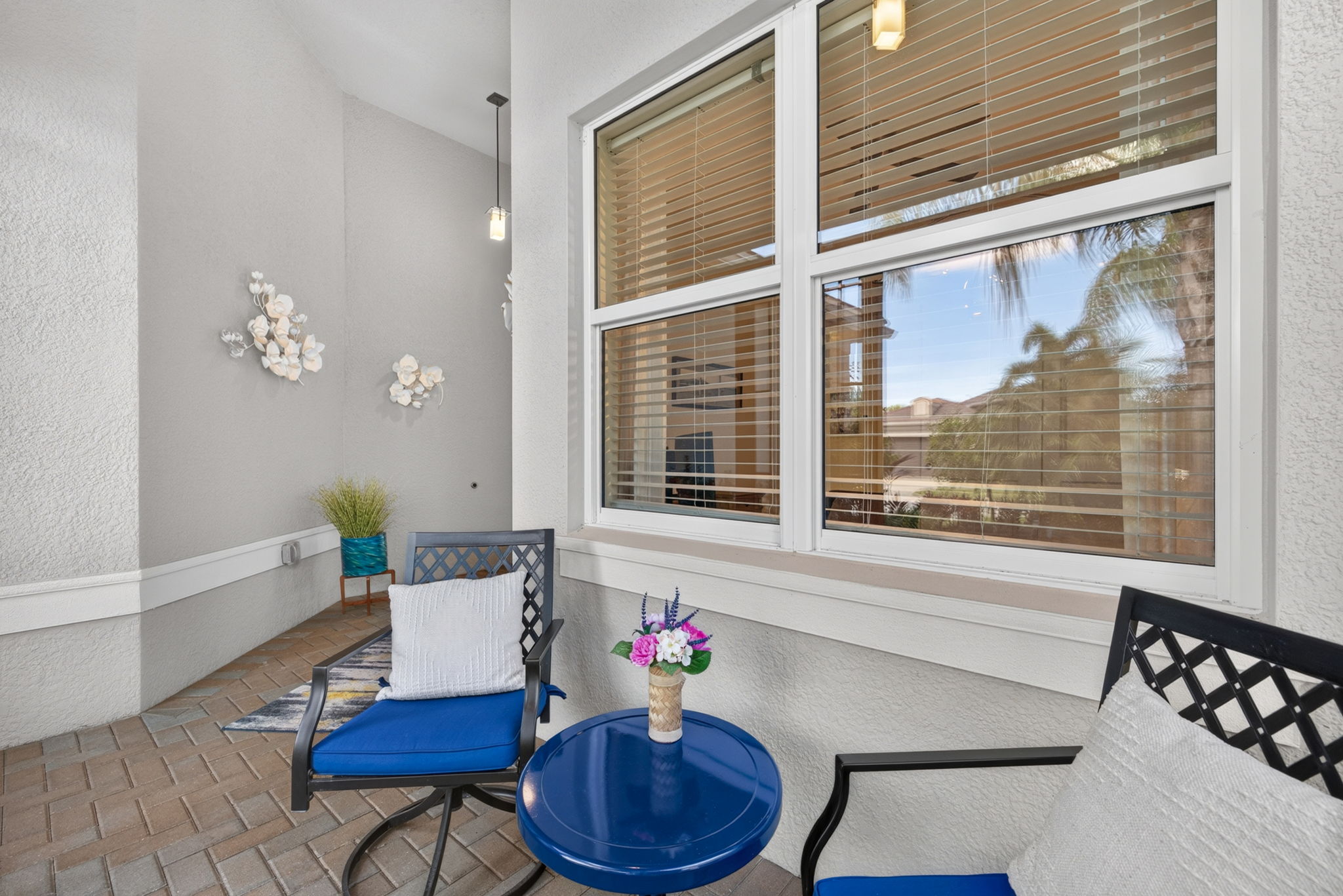 Relax a bit and see your neighbors walking or biking by. This furniture and wall art does convey.