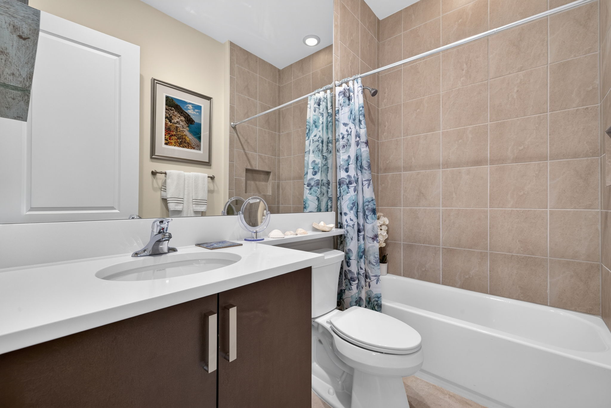 2nd full bath for guests. Floor to ceiling shower tile upgrade present here!