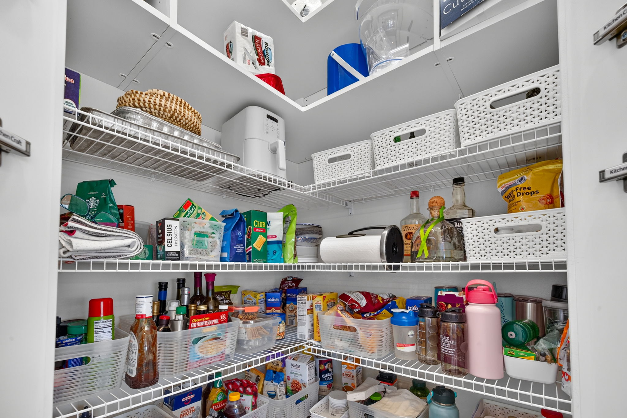 Notice the added two top shelves in this LARGE walk-in pantry! Lots of room for your Costco runs!