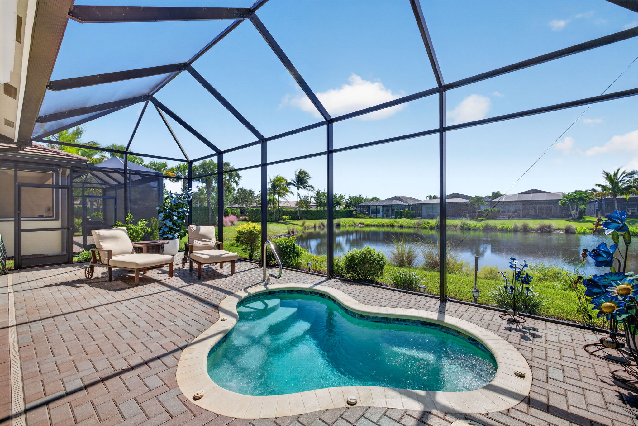 Enjoy this heated, inground home spa with an expansive lake view!!! The community also offers a heated resort sized pool with "beach" access and steps, heated resistance pool, heated lap pool, and a heated grandkids pool.