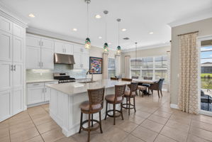 This floor plan allows you to cook and not miss a thing! Your guests can sit at the spacious island and talk to you or help prep in this roomy space!