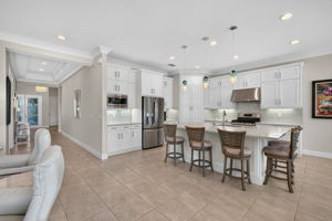 LOTS of counter/workspace present here... a cook's dream! The crown molding throughout main living areas of home elevates the space nicely.