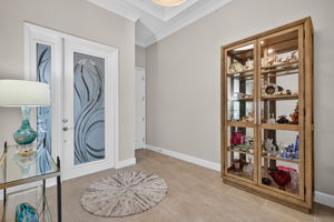ROOM SIZED FOYER is a unique feature of the Sierra model.Note the etched glass entry door and crown molding!