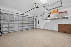 This retractable storage shelf is a lifesaver!!! No ladder required! Upgraded garage flooring.