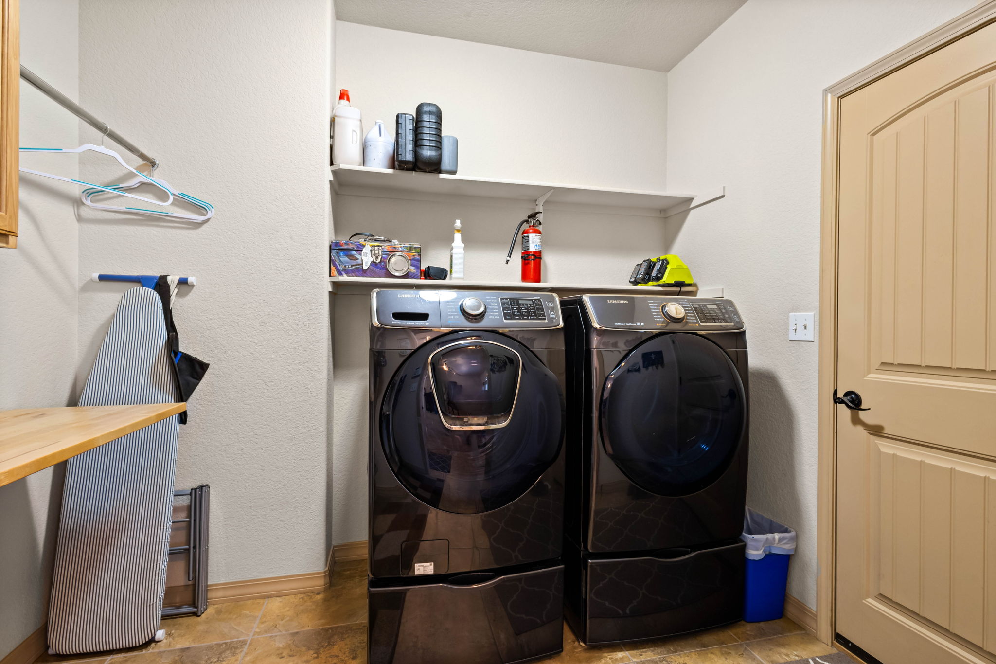 Laundry Room and Owner's Entrance with drop off zone and storage.