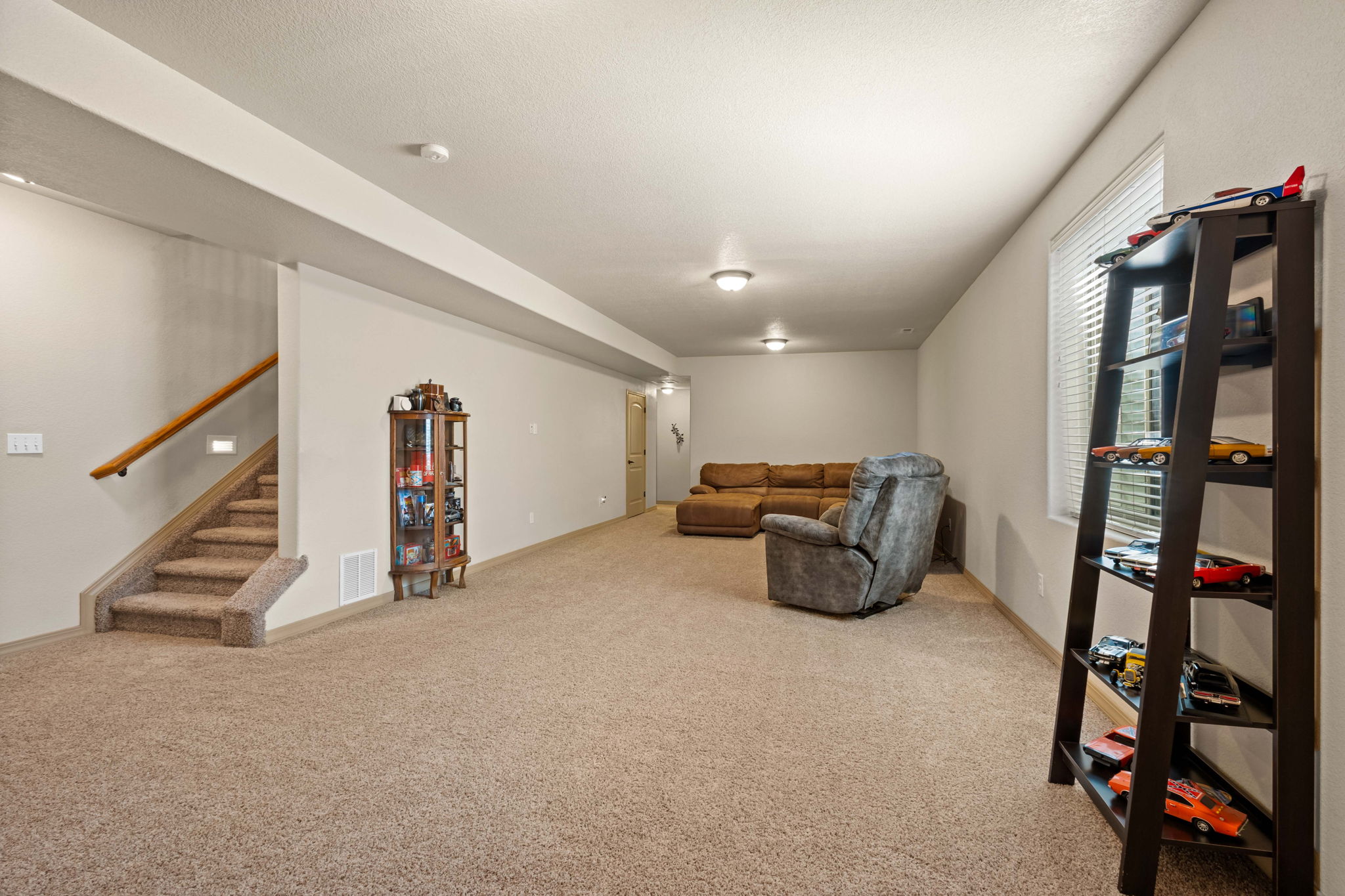 Expansive Family Room with extra storage in the utility area.