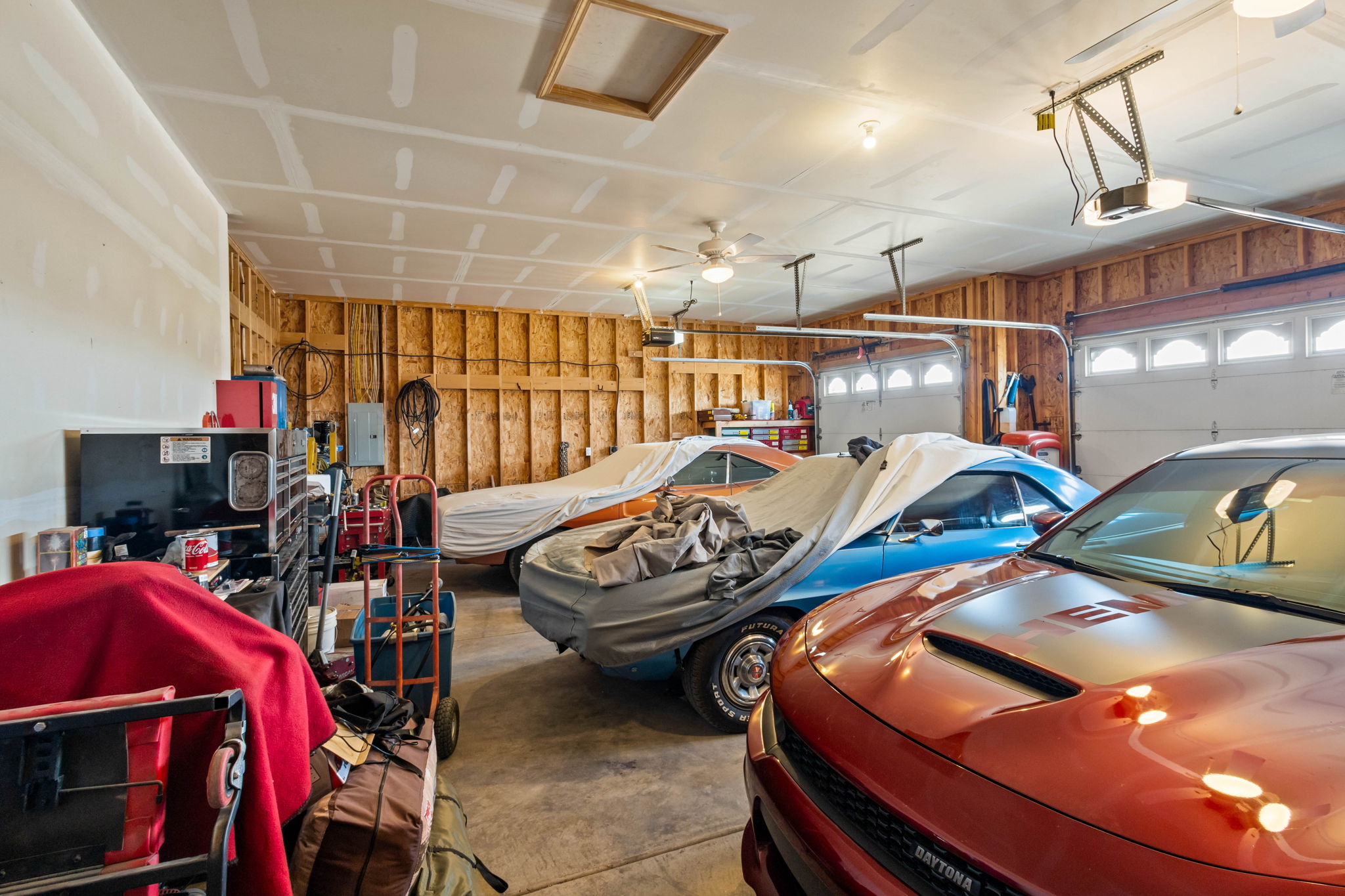 26' 3 Car Garage with ceiling fans, side entrance and plenty of room to work or store your favorite vehicles.