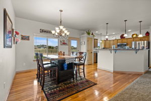 Walk-out dining room with gleaming hardwood floors.