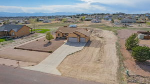 View of the right of the home offering more space to build and grow.  25' equestrian easement perfect for keeping your animals safe.