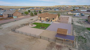 View of the large carport and shed.  Easy store a boat, large vehicle or convert to house animals.