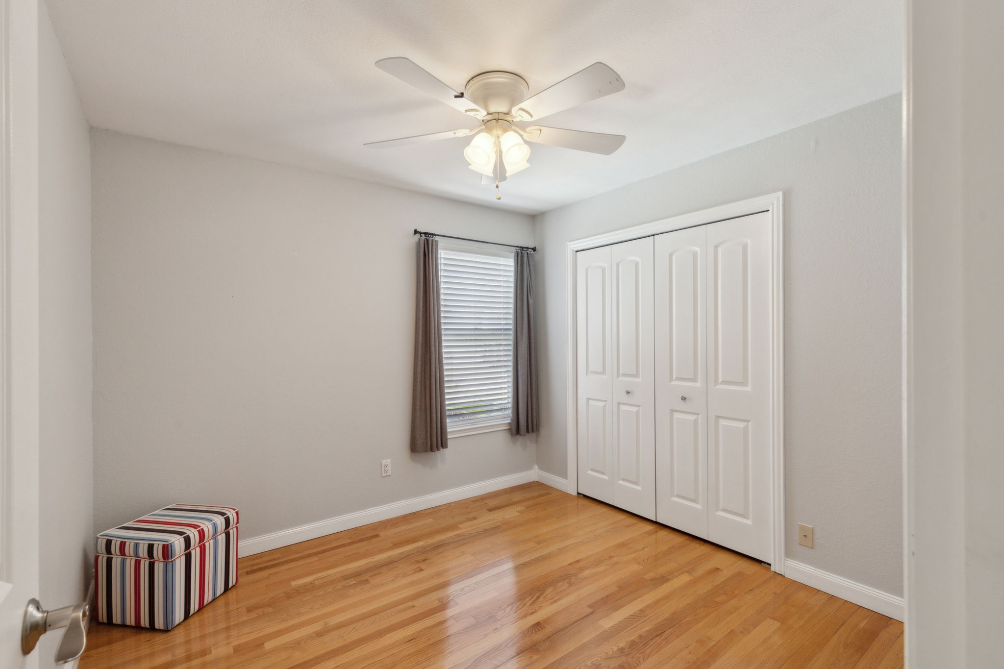 This is the middle bedroom - lovely flooring and large closet.