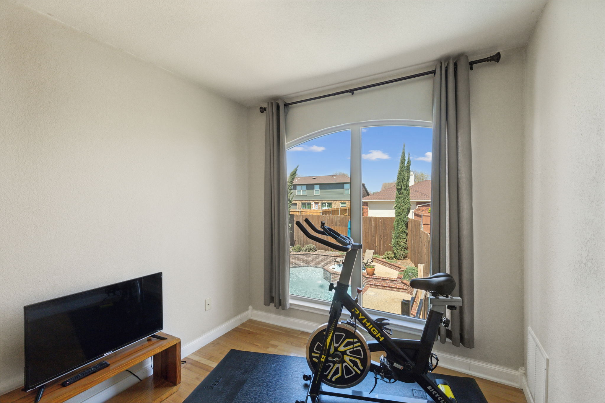 Next is the Flex Area with Spectacular views of the private backyard and pool area!