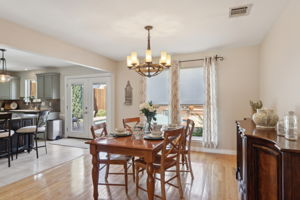 The Dining Area is perfect for family dinners or entertaining - the attractive lighting - warm wood flooring and spectacular views to the backyard pool area, make this room special!