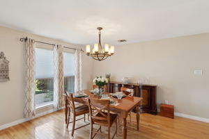 The Formal Dining area is spacious enough for even the largest of table - Don't miss the attractive windows showcasing the oasis of a backyard!