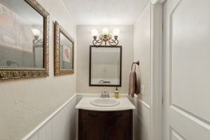 This lovely half bath is nestled away and yet so convenient for guests and family!