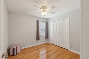 This is the middle bedroom - lovely flooring and large closet.