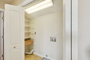 The full size laundry area is tucked away, but still close to all three of the upstairs bedrooms!