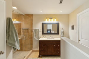 Another view of the Master Ensuite - the Large Master Closet is to the right - notice the charming pocket door!
