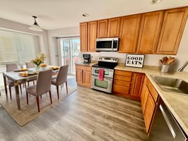 Kithen w_new flooring virtually staged.jpeg