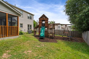 Wood Playset in Back Yard