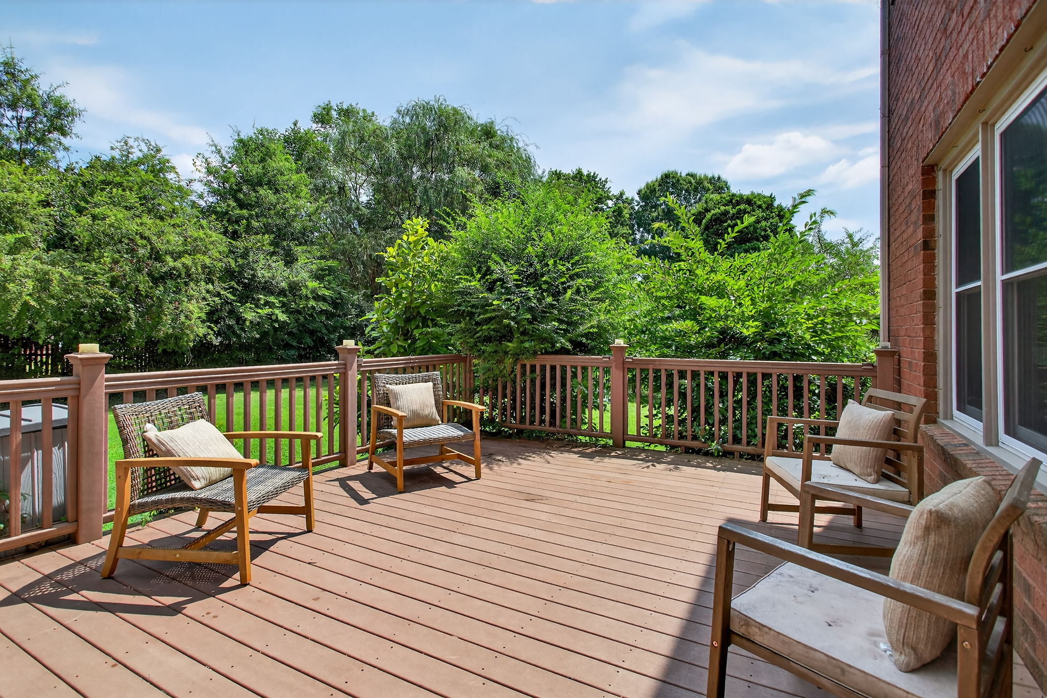 Low-maintenance composite deck just off the home, perfect for grilling, dining, or soaking up the sun.