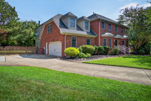 Ample parking with deep driveway and 2-car garage.