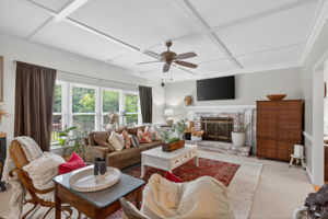 Central den with fireplace, perfect for gathering—open to the heart of the home.