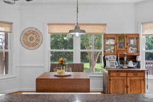 Bright breakfast area filled with natural light, just steps from the sunroom.