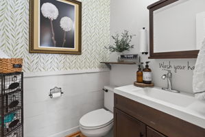 Lovely downstairs bathroom near sunroom and laundry area.