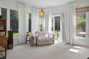 Tucked-away sunroom with easy flow to the backyard.
